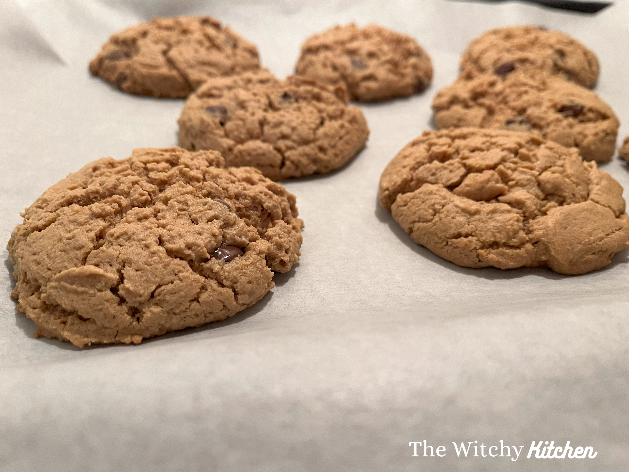 Peanut butter chocolate chip cookies by The Witchy Kitchen.