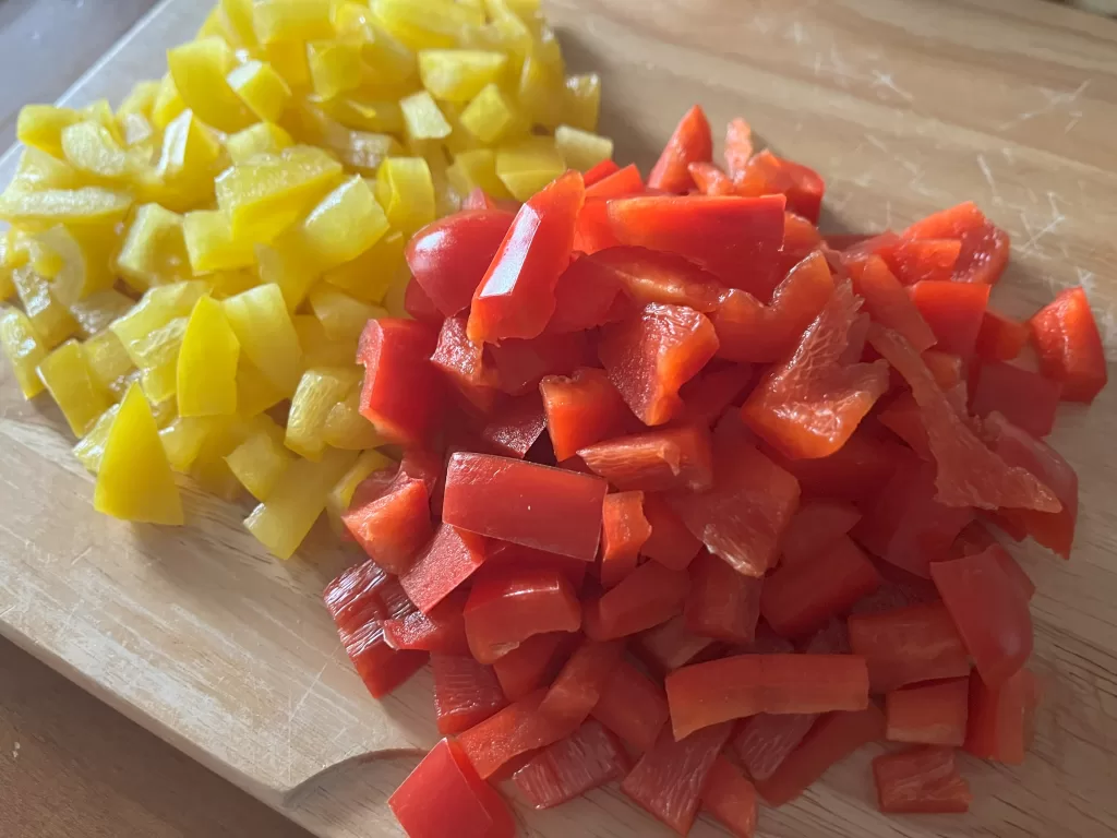 Diced bell pepper on a cutting board.